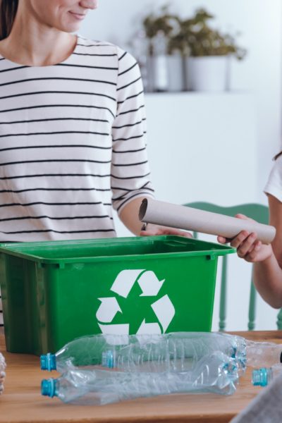 Mother teaching how to recycle
