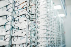Eyeglasses and sunglasses showcase in optic shop