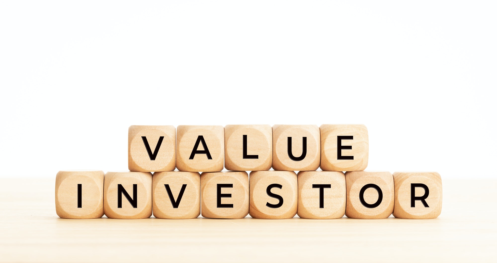 Value investor phrase on wooden block shape