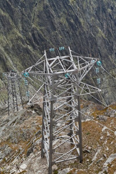 Electric power line in extremely high rocky mountains