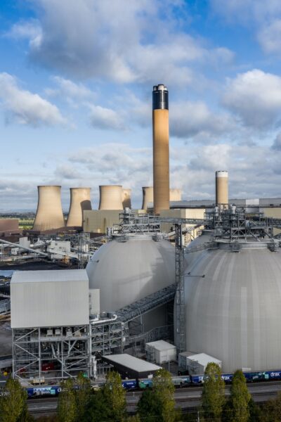 Aerial view of a coal fired power station with biomass fuel storage tanks for carbon capture