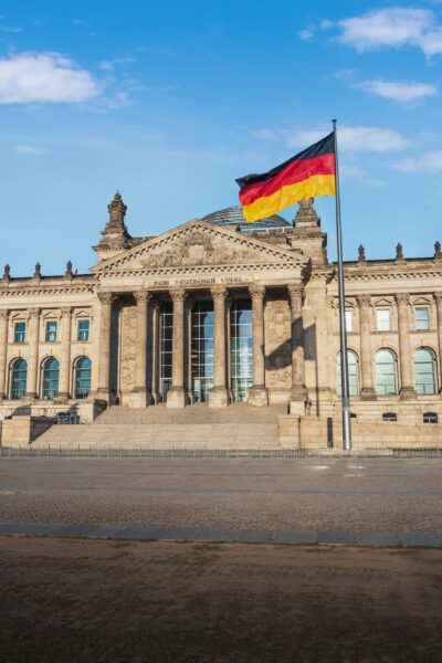 German Parliament (Bundestag) - Reichstag Building with German Flag - Berlin, Germany