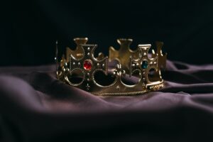 retro golden crown with gemstones on black cloth