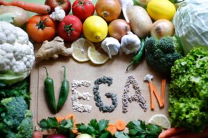 Vegan food, text, vegetables and fruits