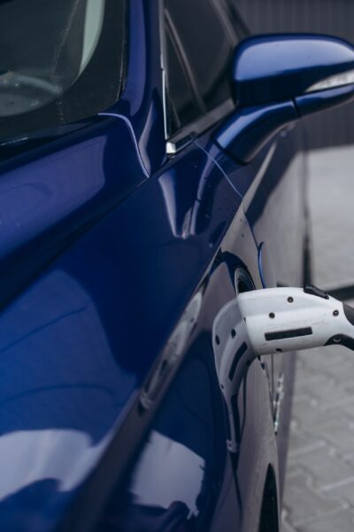 EV Car or Electric car at charging station with the power cable supply plugged