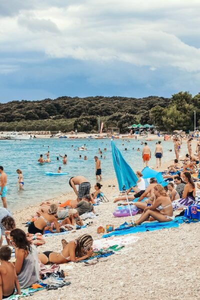Crowds of people on beach in summer on vacation.