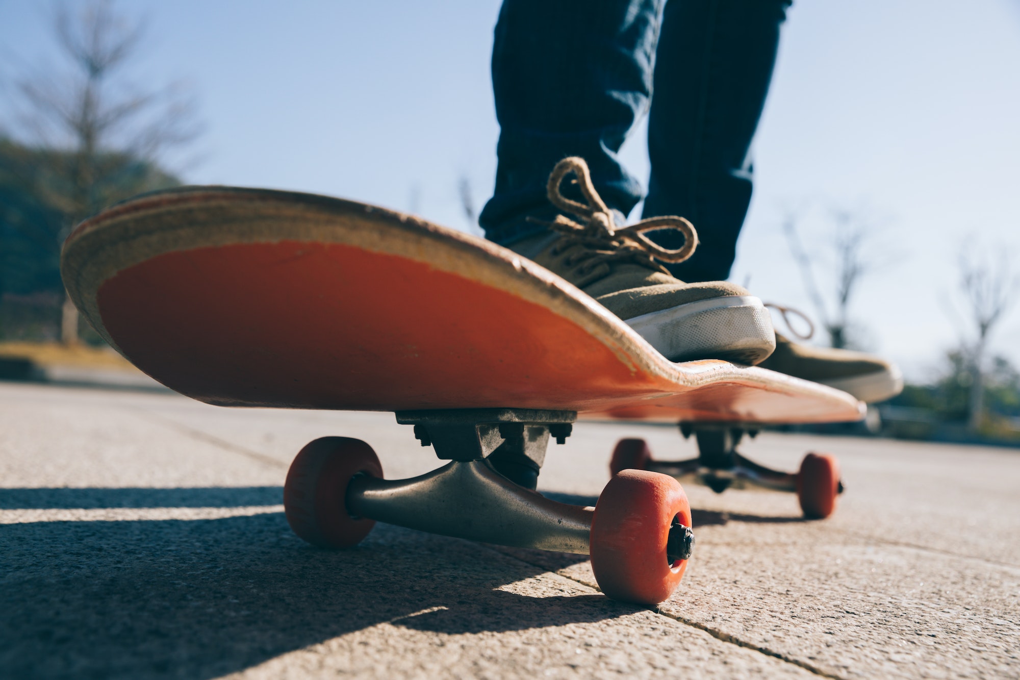Skateboarder skateboarding outdoors on sunny morning