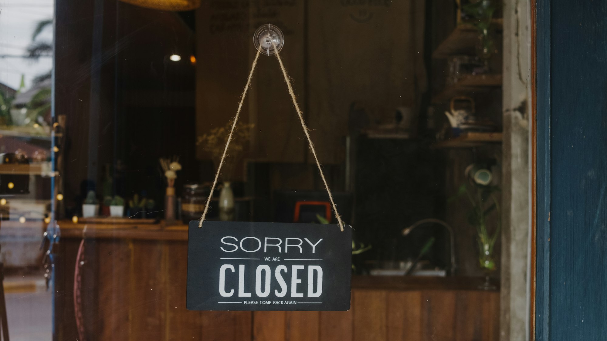 Sorry we're closed vintage black and white retro sign on a coffee glass door cafe